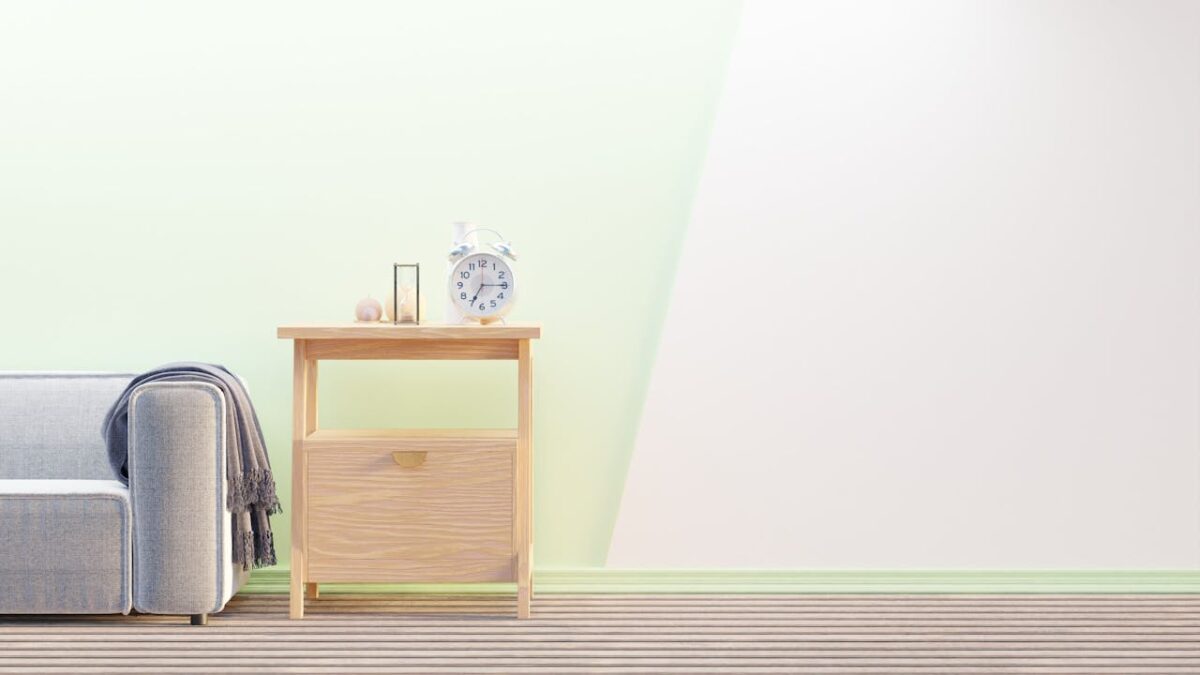 Huardière Cozy minimalist living room with wooden furniture and a clock on the side table.